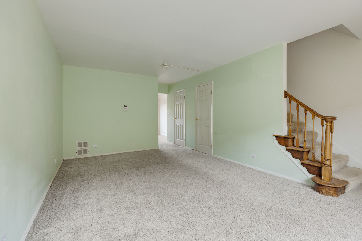 1790 Sessions Walk Hoffman Estates, IL 60169 - Photo 4 of 17 a view of an empty room with stairs