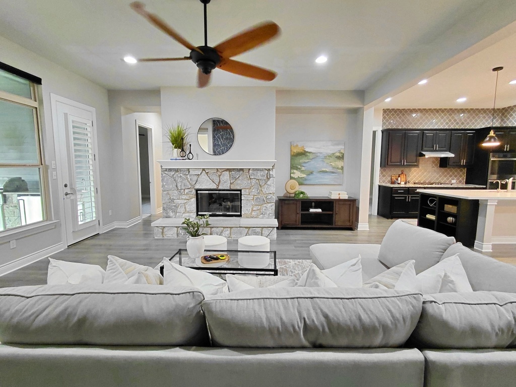225 Escarpment Way Cedar Park, TX 78613 - Photo 7 of 40 a living room with furniture and a fireplace