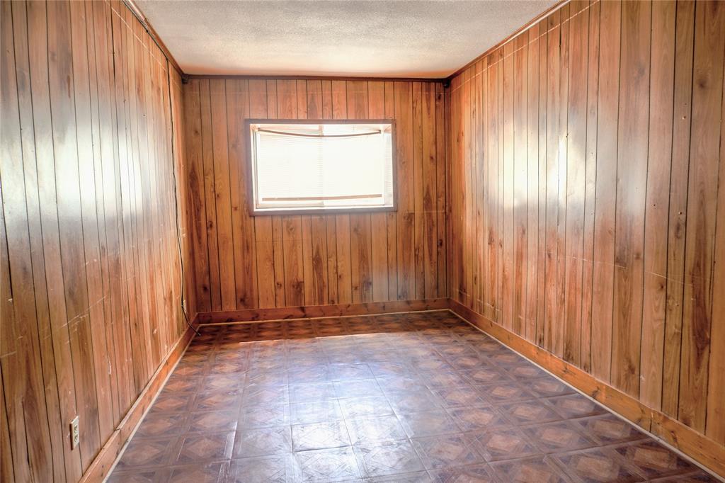 300 Coury Road Everman, TX 76140 - Photo 18 of 29 an empty room with windows
