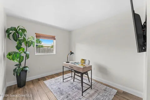 a bedroom with a bed and a lamp