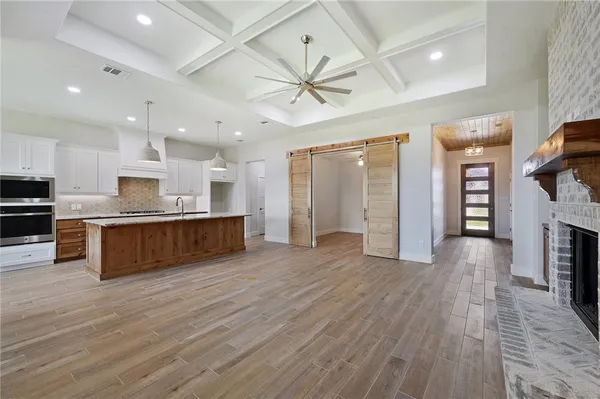 a view of kitchen with cabinets and stainless steel appliances
