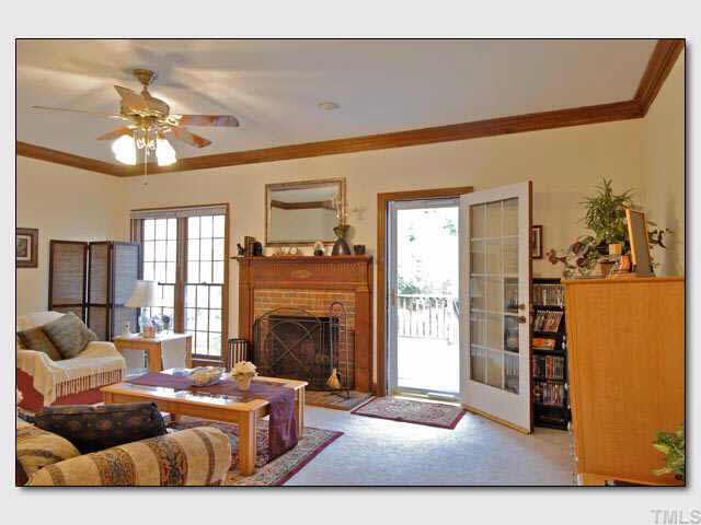 102 Skylark Way Raleigh, NC 27615 - Photo 3 of 10 a living room with furniture and a fireplace