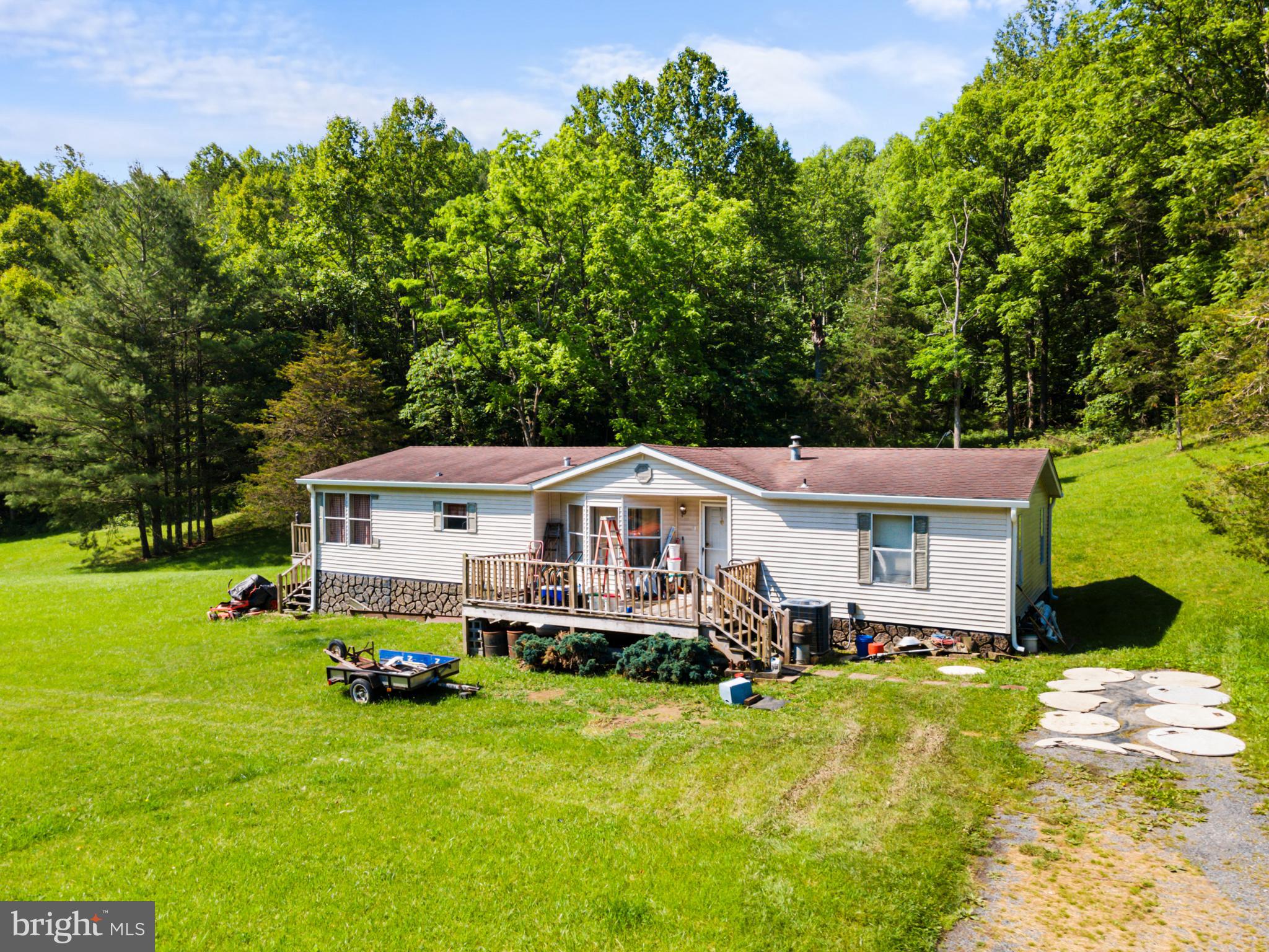 8883 Crooked Run Road Basye, VA 22810 - Photo 2 of 22 a front view of a house with garden