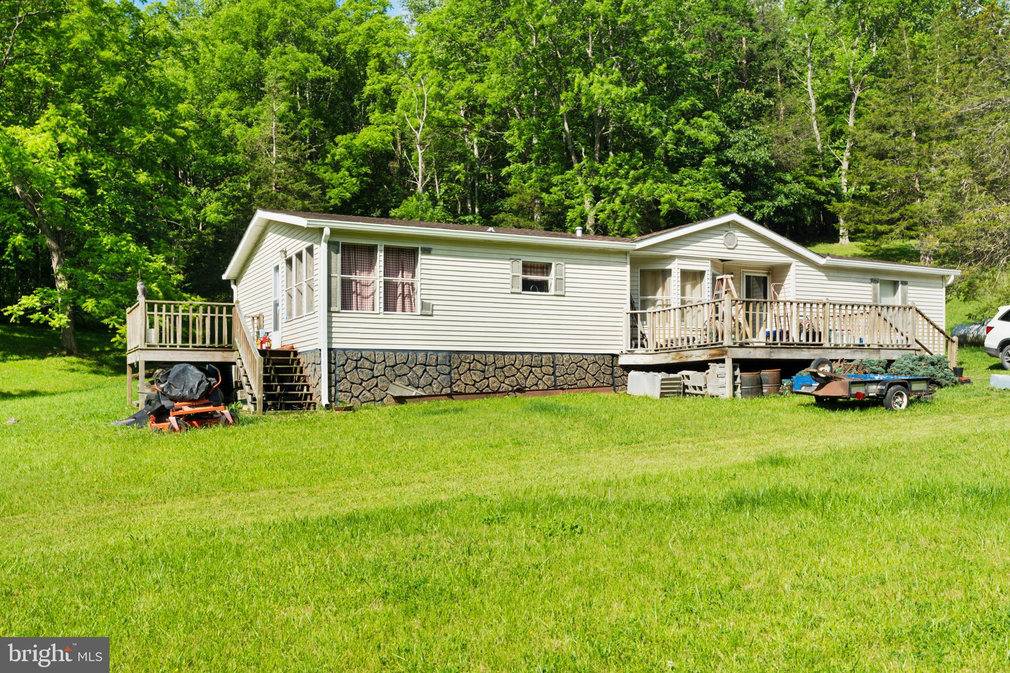 8883 Crooked Run Road Basye, VA 22810 - Photo 3 of 22 a view of a house with a yard and sitting area
