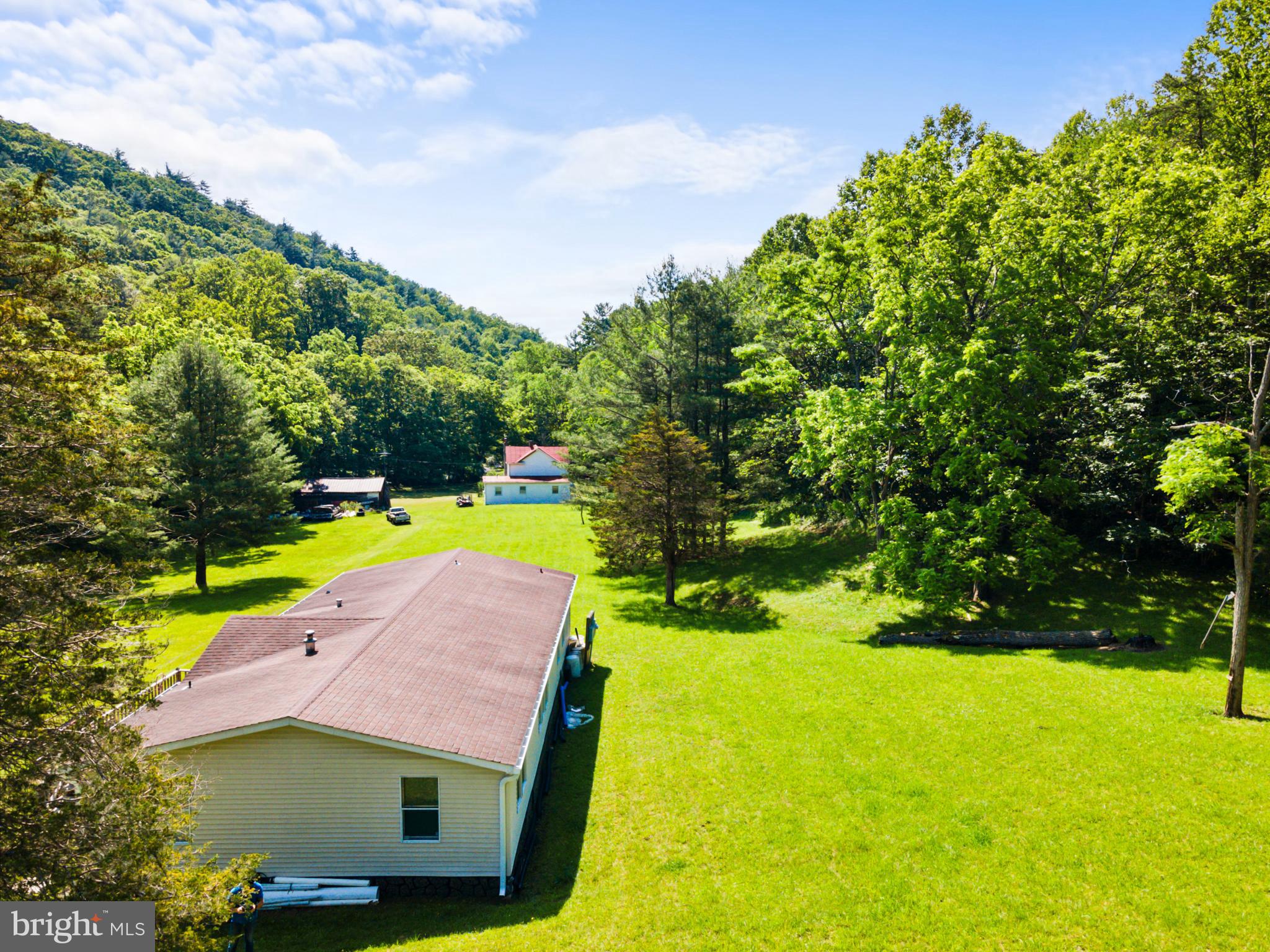 8883 Crooked Run Road Basye, VA 22810 - Photo 6 of 22 a small yard with swimming pool and garden