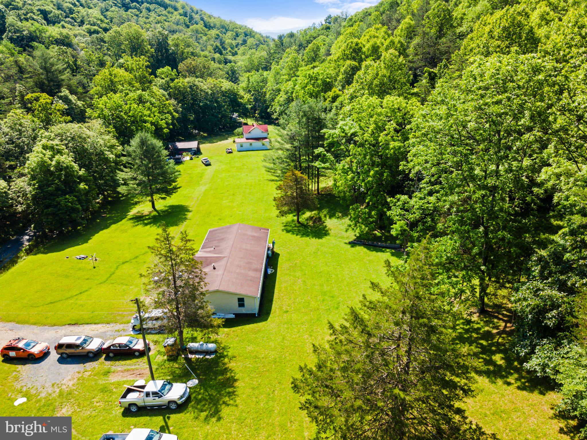 8883 Crooked Run Road Basye, VA 22810 - Photo 7 of 22 a view of a swimming pool a yard and mountain view