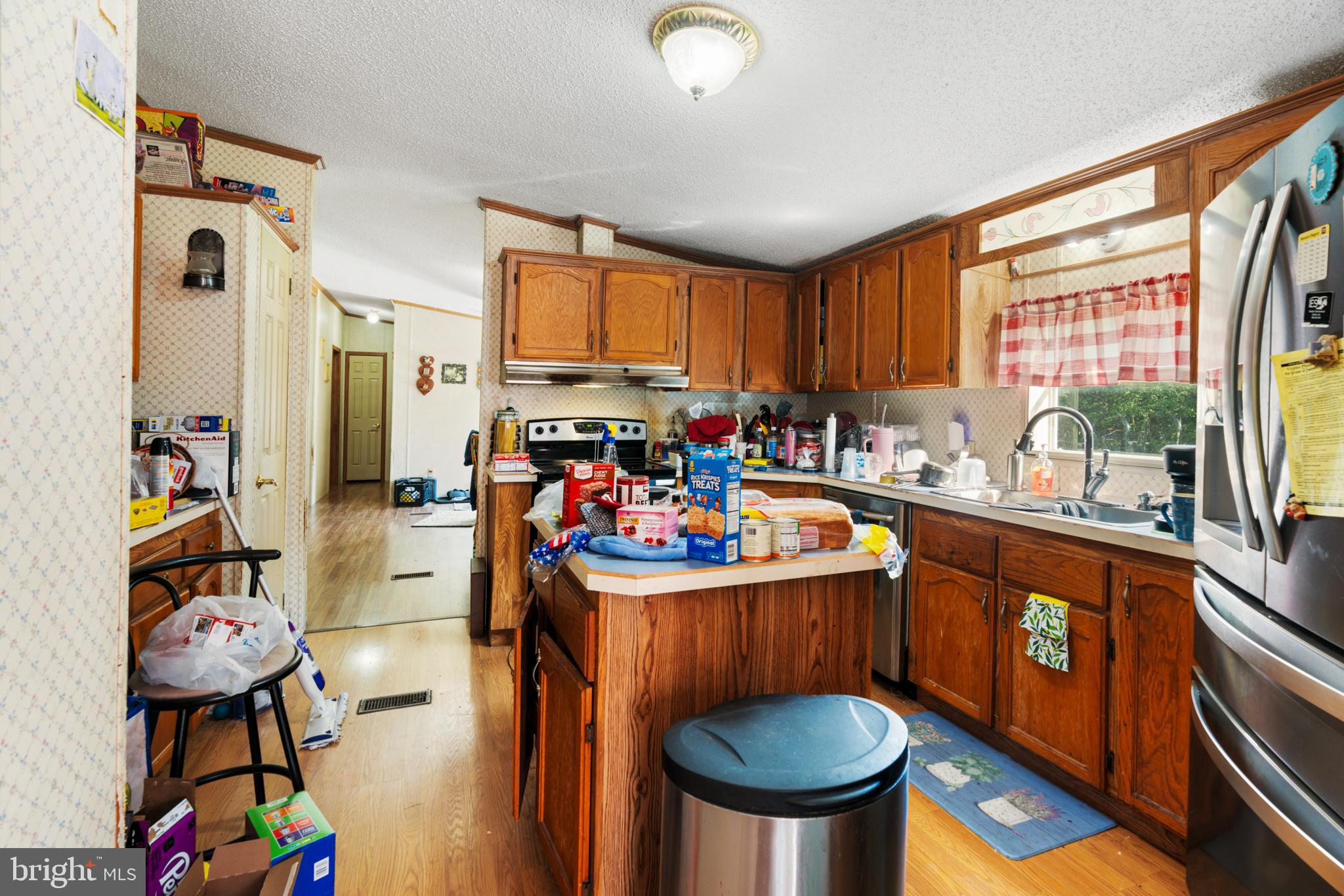 8883 Crooked Run Road Basye, VA 22810 - Photo 10 of 22 a kitchen with stainless steel appliances a stove a sink and a refrigerator