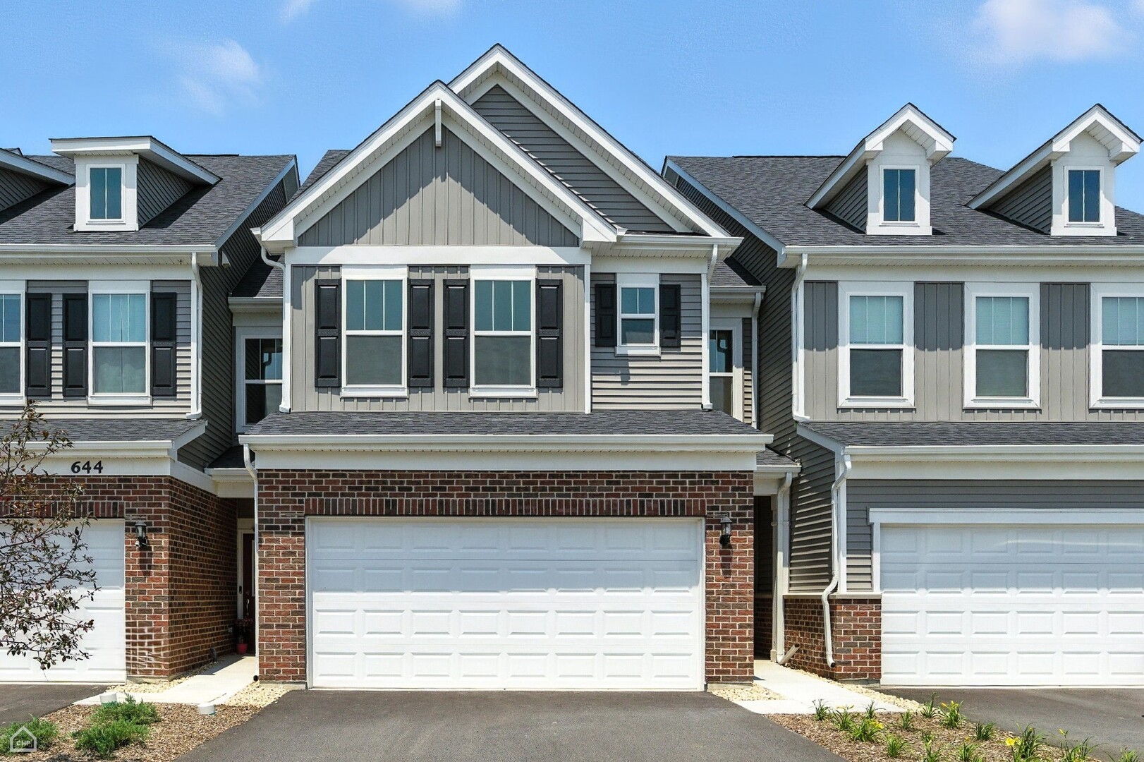 a front view of a house with a garage