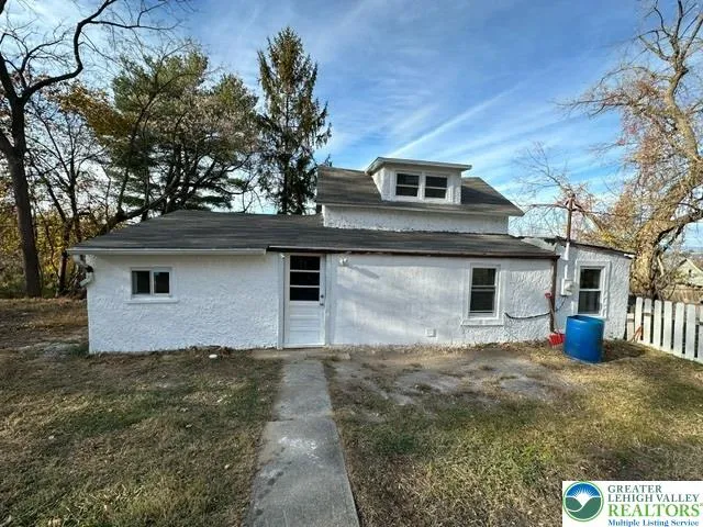 a front view of a house with yard