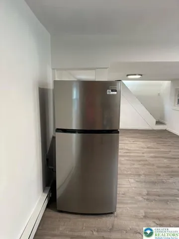 a view of a refrigerator in kitchen