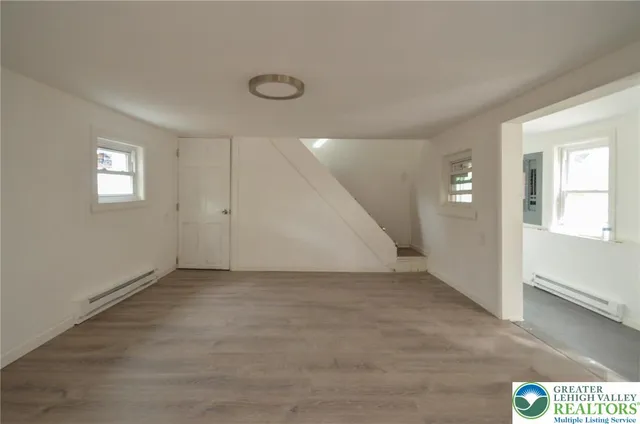 a view of an empty room with a window