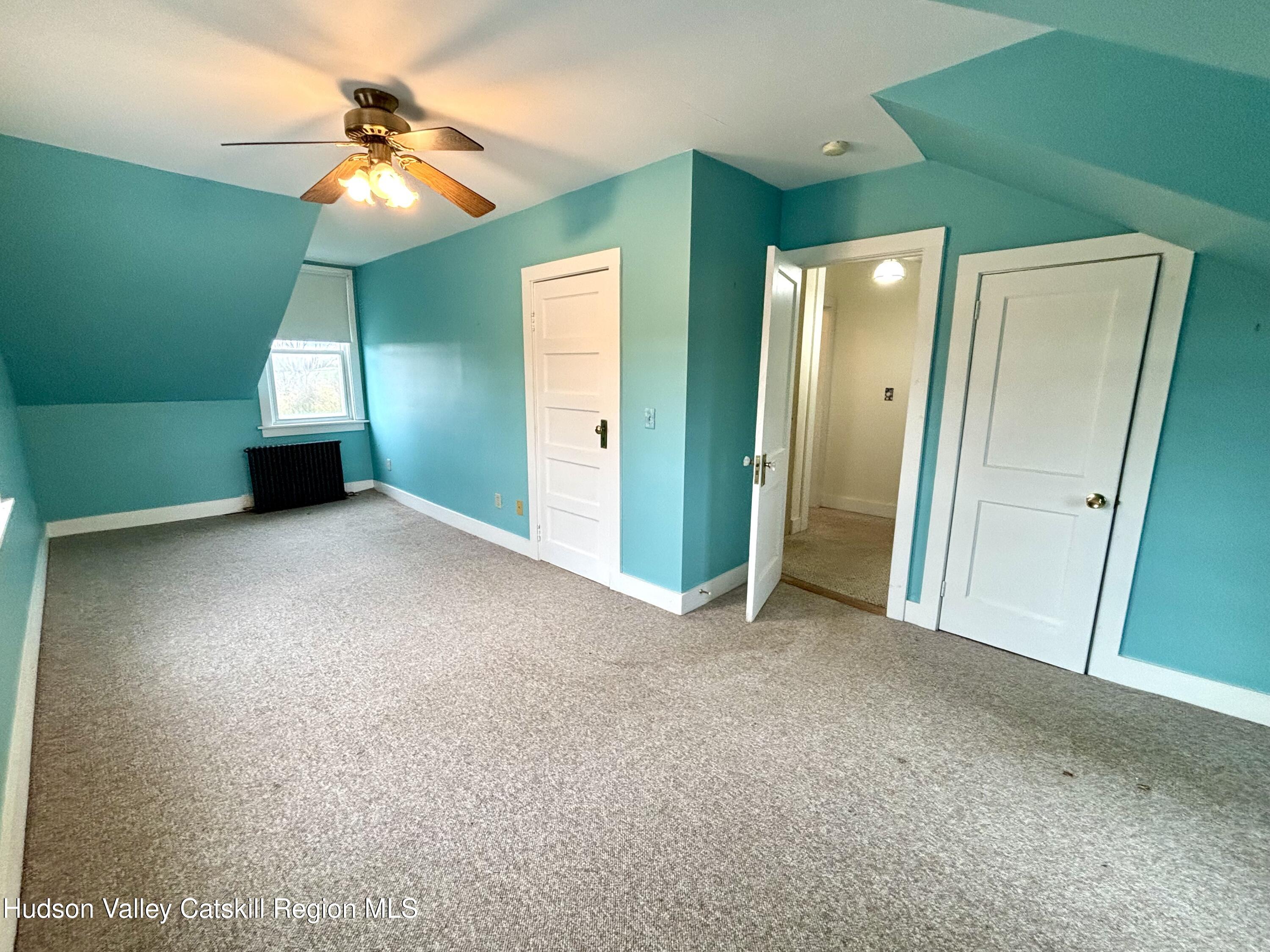 470 County Rte 28B Valatie, NY 12184 - Photo 14 of 20 a view of a livingroom with a chandelier fan and a large window