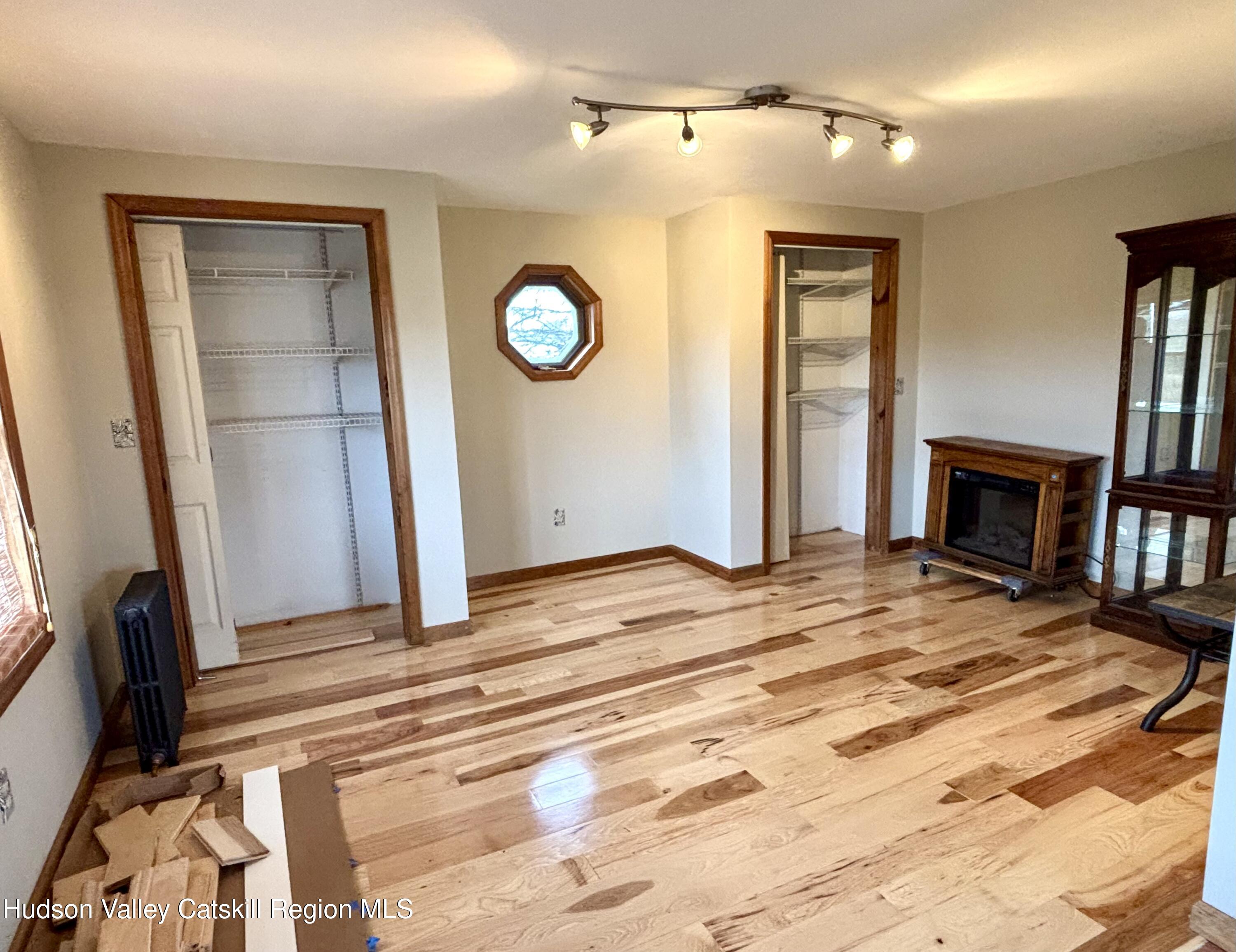470 County Rte 28B Valatie, NY 12184 - Photo 3 of 20 a view of a livingroom with wooden floor and closet