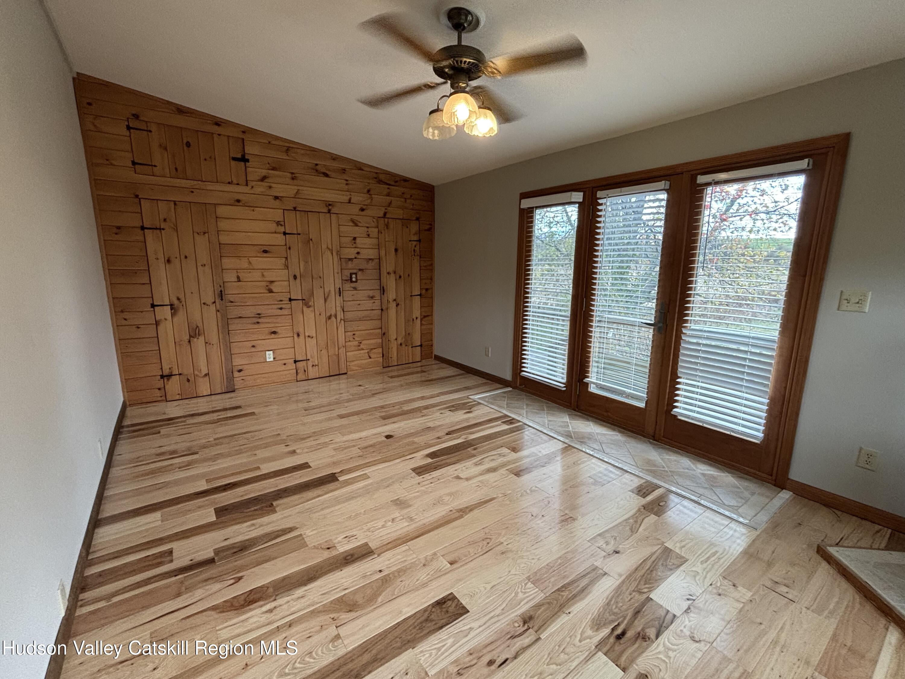 470 County Rte 28B Valatie, NY 12184 - Photo 8 of 20 wooden floor in an empty room with a window