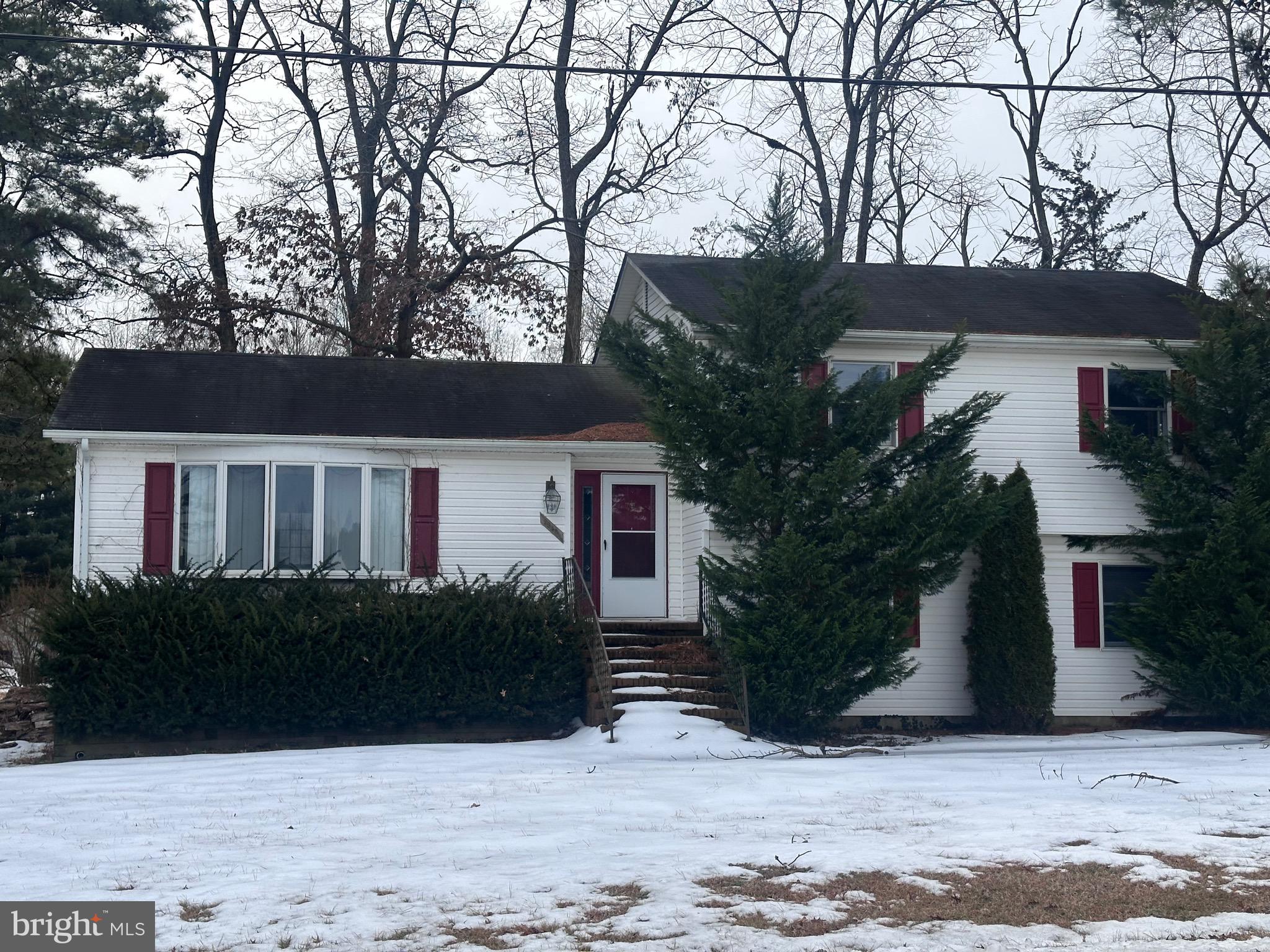 2948 Andrews Lake Road Felton, DE 19943 - Photo 1 of 29 a front view of house with yard and trees in the background