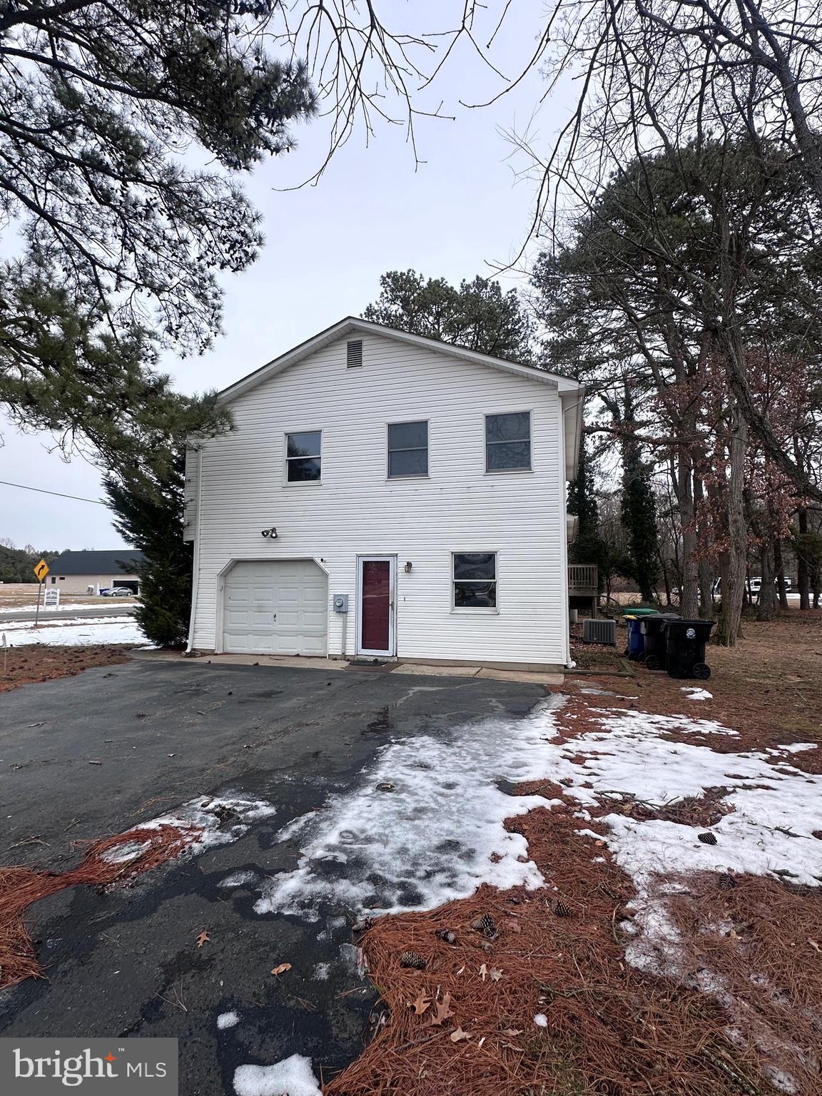 2948 Andrews Lake Road Felton, DE 19943 - Photo 2 of 29 a view of a white house with a yard covered with snow