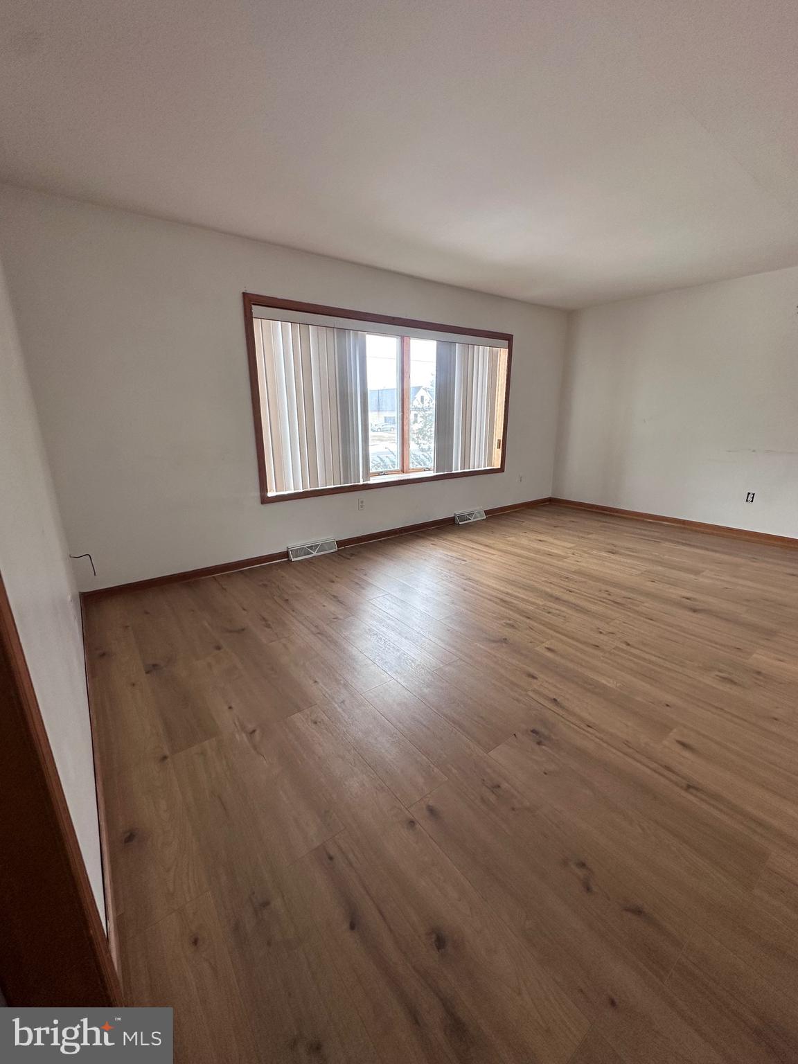 2948 Andrews Lake Road Felton, DE 19943 - Photo 21 of 29 wooden floor in an empty room with a window