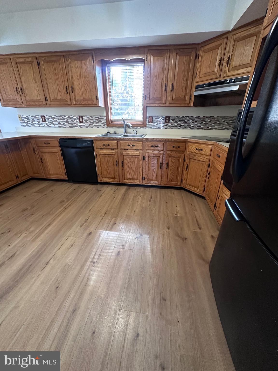 2948 Andrews Lake Road Felton, DE 19943 - Photo 24 of 29 a view of kitchen with wooden floor and electronic appliances