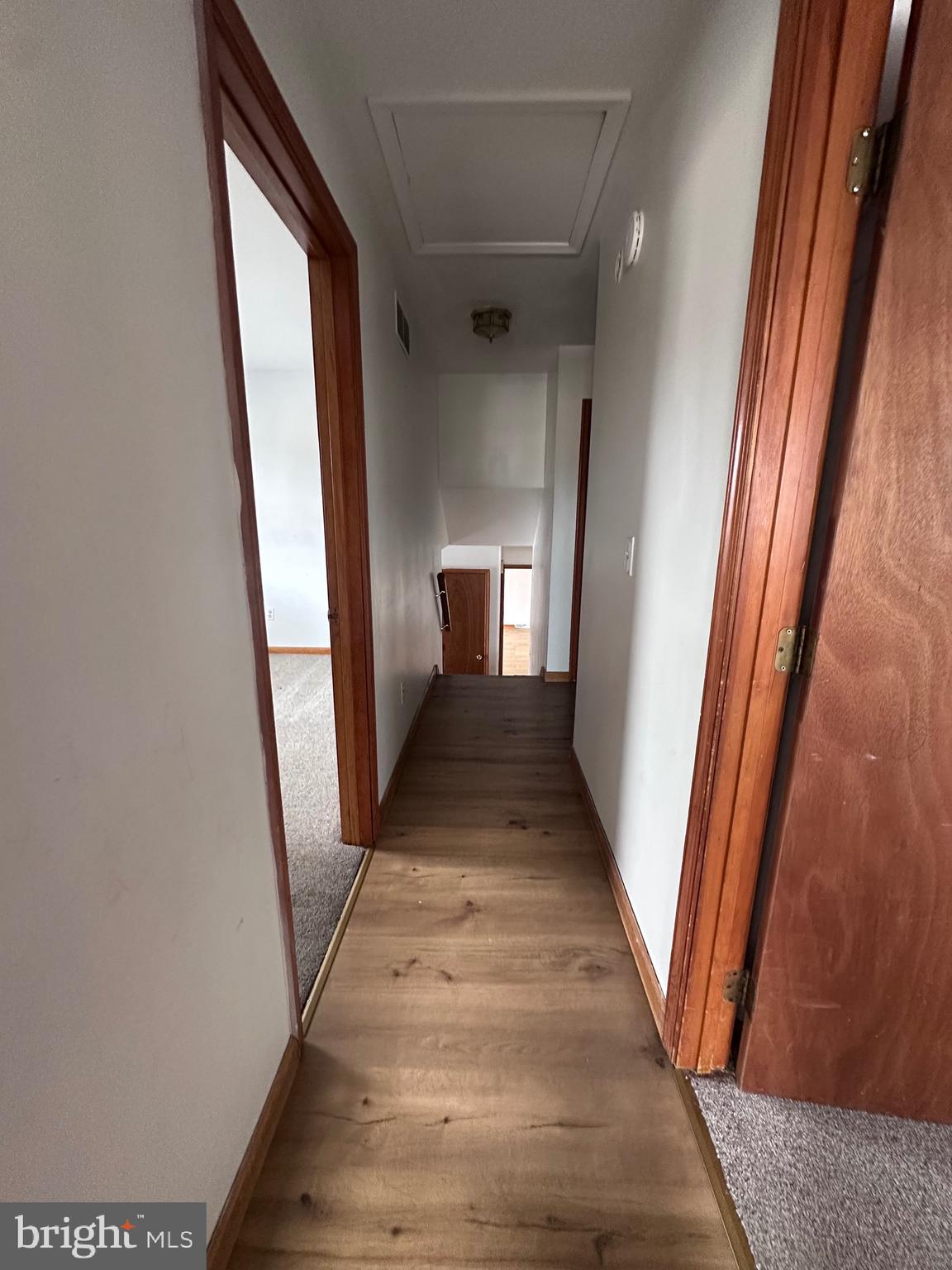 2948 Andrews Lake Road Felton, DE 19943 - Photo 10 of 29 a view of a hallway with wooden floor and staircase
