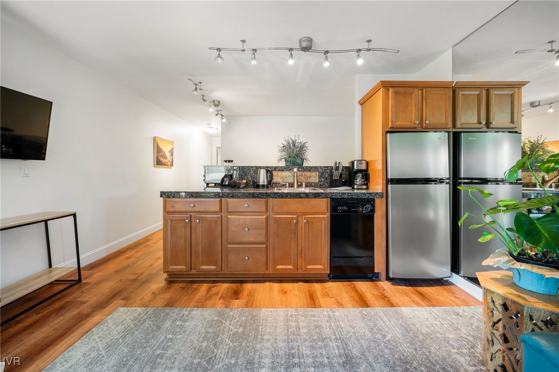699 Hogan Court, Unit 2 Incline Village, NV 89451 - Photo 17 of 39 a kitchen with stainless steel appliances granite countertop a refrigerator a stove a sink and a microwave
