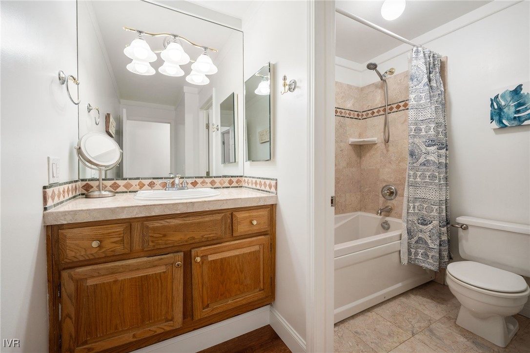 699 Hogan Court, Unit 2 Incline Village, NV 89451 - Photo 19 of 39 a bathroom with a sink a toilet a mirror a bathtub and shower