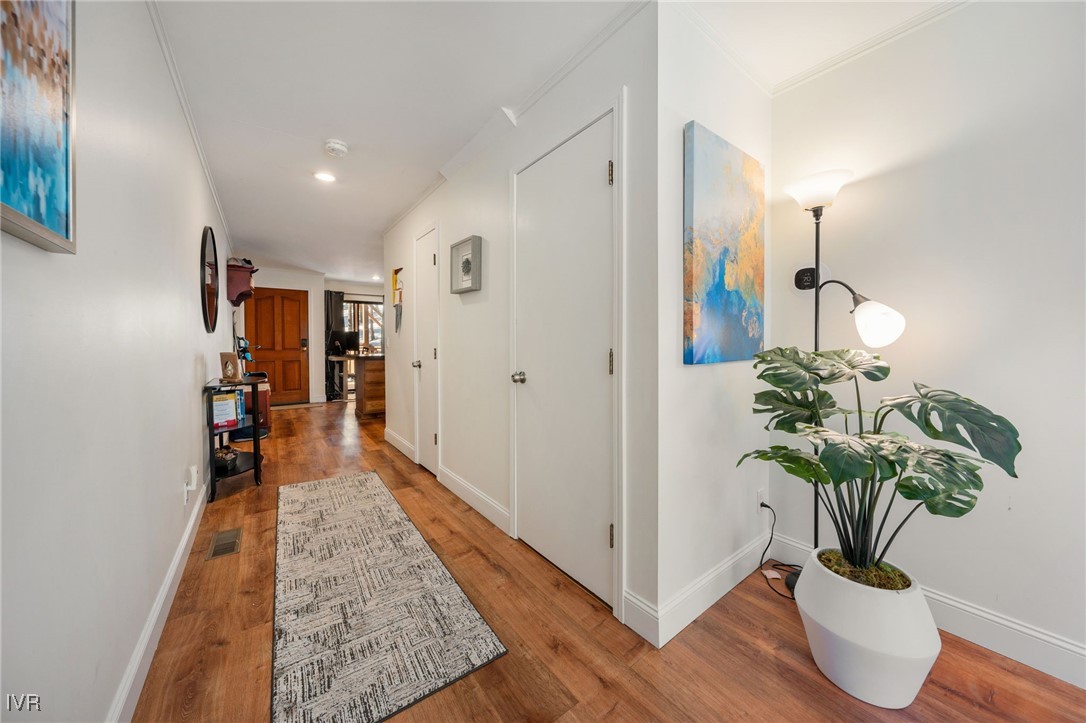 699 Hogan Court, Unit 2 Incline Village, NV 89451 - Photo 25 of 39 a hallway with wooden floor and a potted plant