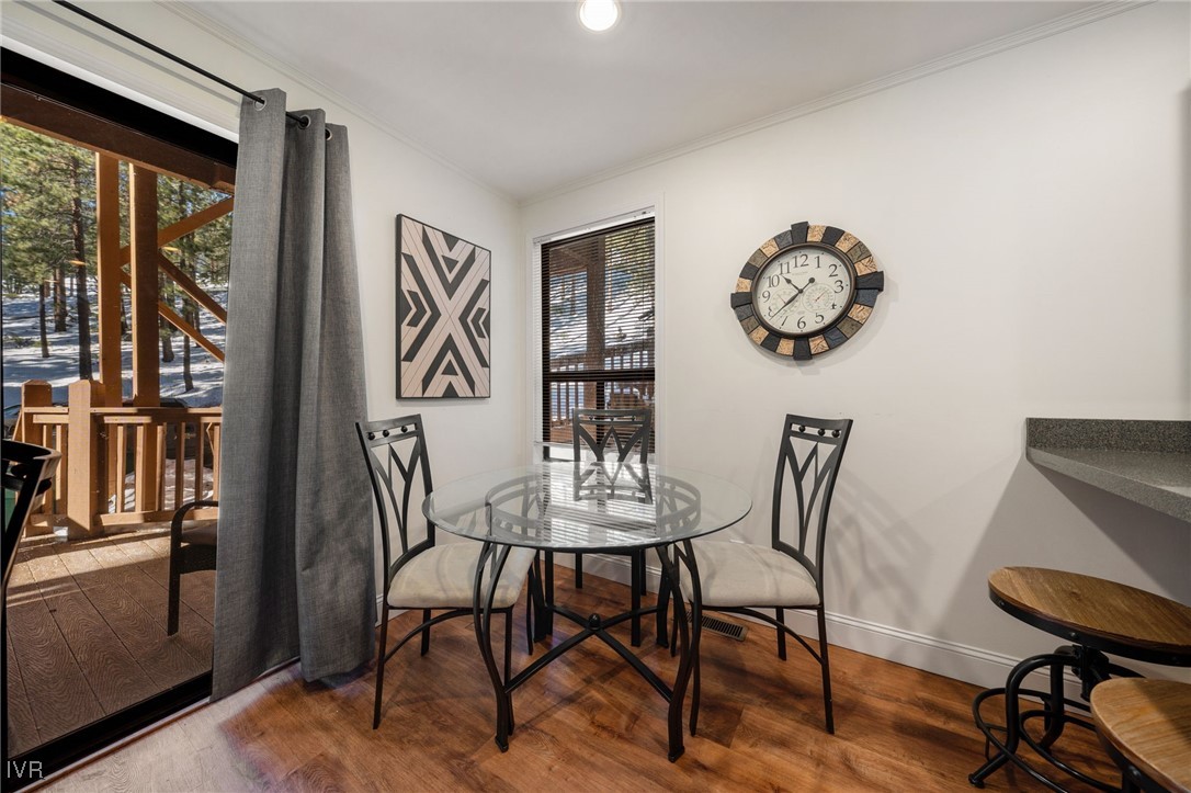 699 Hogan Court, Unit 2 Incline Village, NV 89451 - Photo 28 of 39 a view of a dining room with furniture window and wooden floor