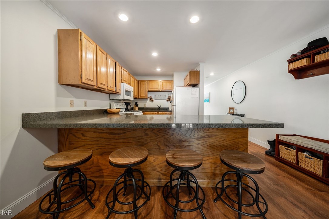 699 Hogan Court, Unit 2 Incline Village, NV 89451 - Photo 30 of 39 a kitchen with a table chairs stove and cabinets