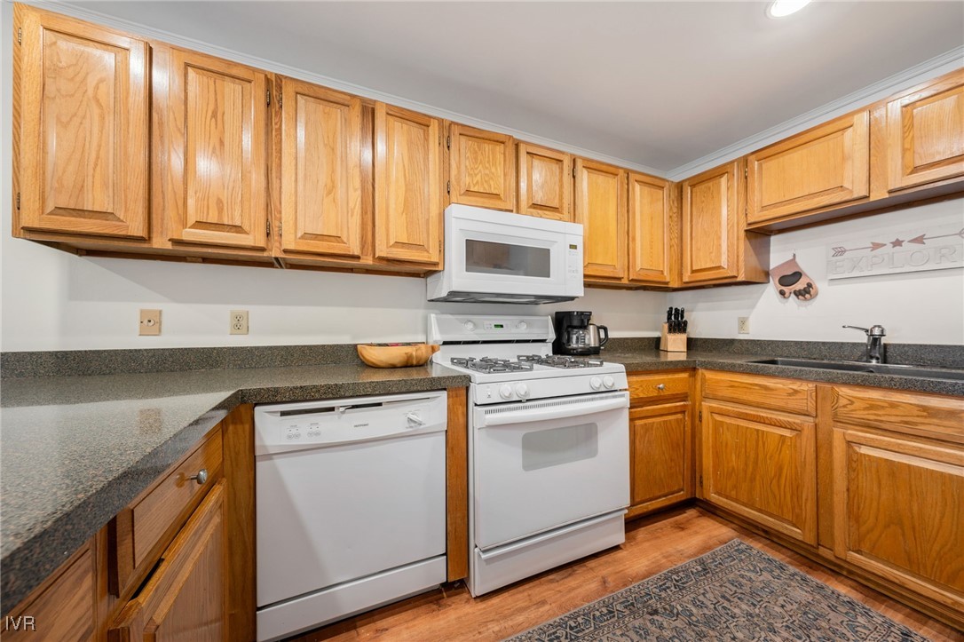 699 Hogan Court, Unit 2 Incline Village, NV 89451 - Photo 3 of 39 a kitchen with stainless steel appliances granite countertop a sink a stove cabinets and a refrigerator