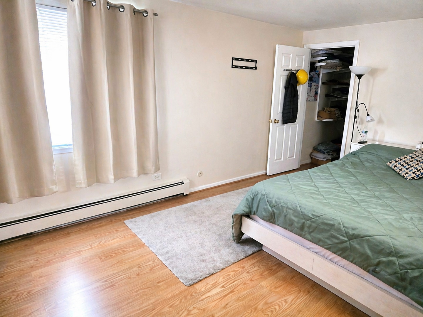 269 7th Street Wheeling, IL 60090 - Photo 13 of 30 a bed sitting in a bedroom next to a window