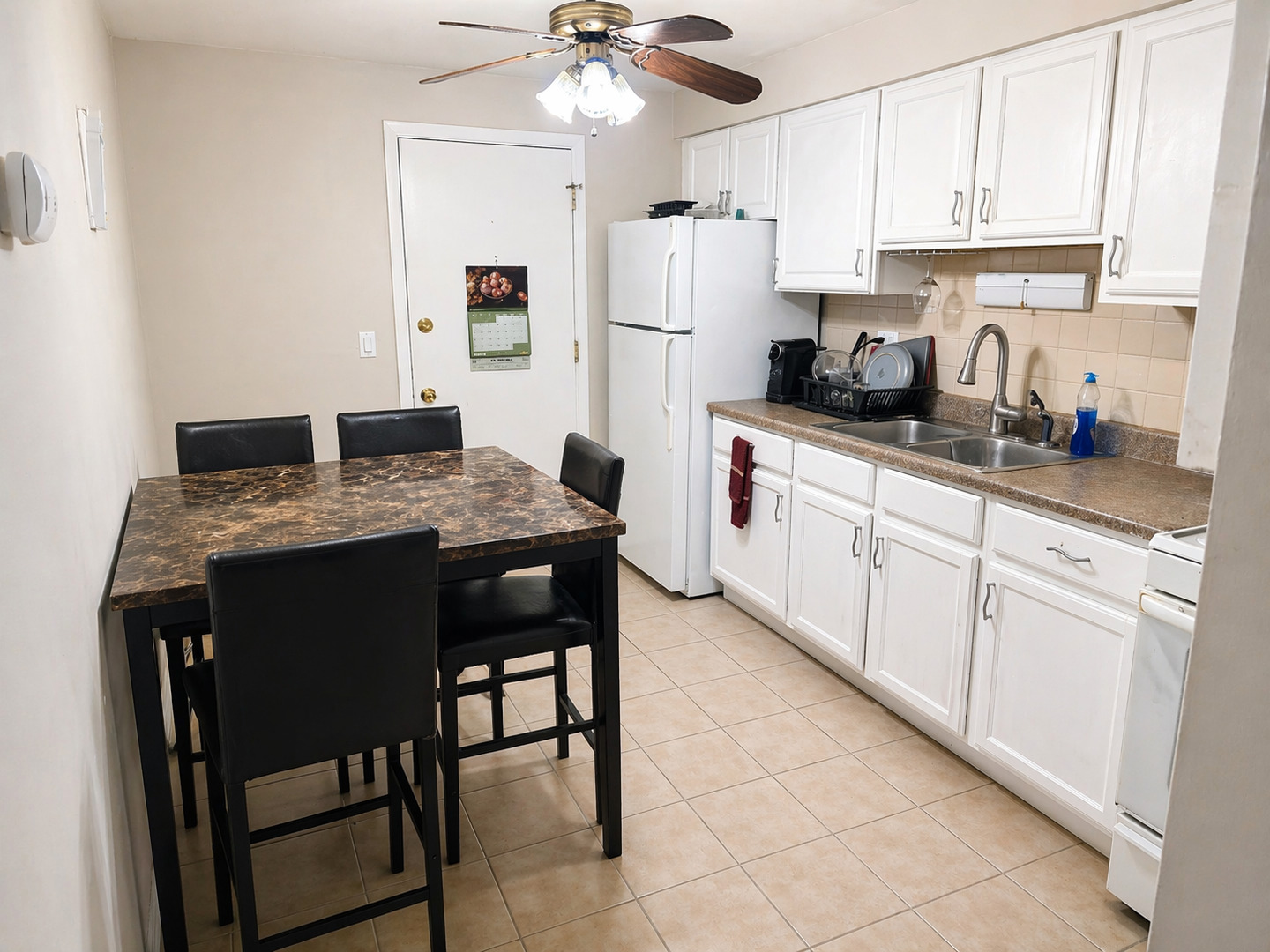 269 7th Street Wheeling, IL 60090 - Photo 14 of 30 a kitchen with stainless steel appliances granite countertop a sink dishwasher a stove a refrigerator and white cabinets with wooden floor