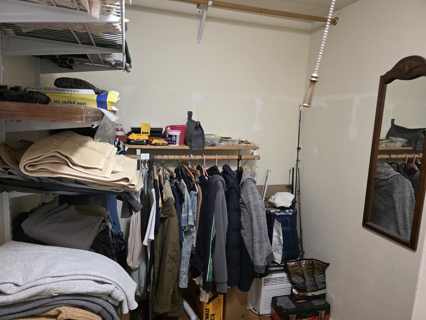 269 7th Street Wheeling, IL 60090 - Photo 15 of 30 a view of walk in closet with clothes and shoes