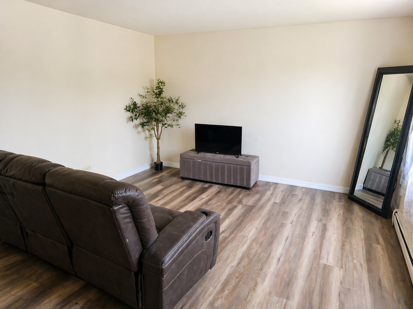 269 7th Street Wheeling, IL 60090 - Photo 16 of 30 a living room with furniture and a flat screen tv