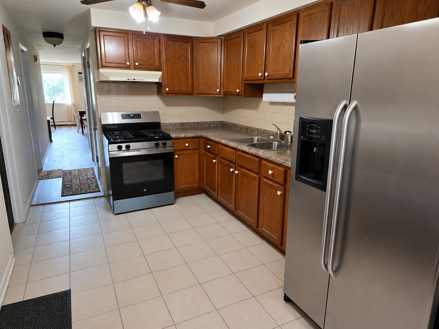 269 7th Street Wheeling, IL 60090 - Photo 8 of 30 a kitchen with stainless steel appliances granite countertop a refrigerator a stove and a sink