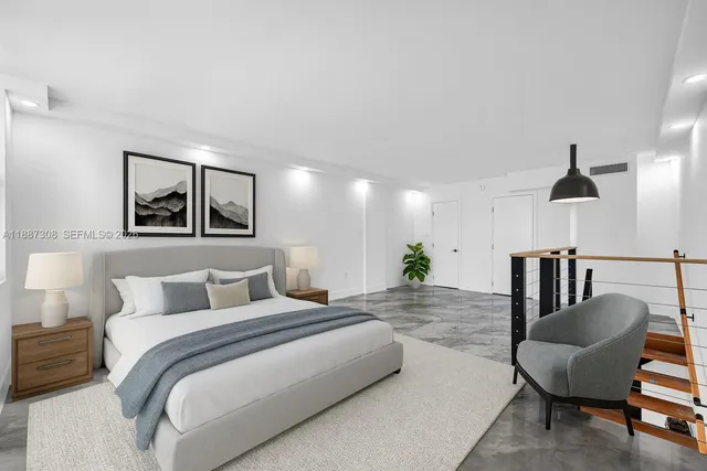 a bedroom with furniture and a painting on the wall