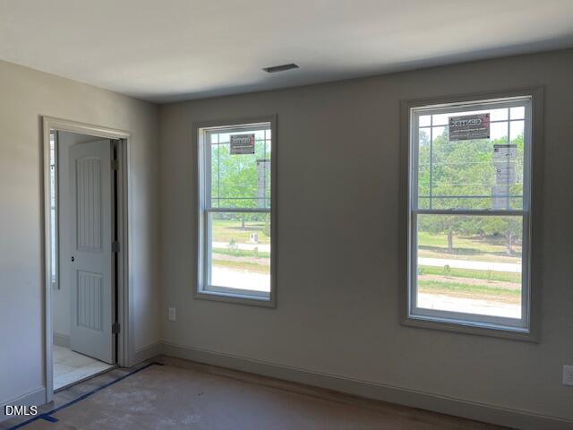 169 Big Pine Road Clayton, NC 27520 - Photo 12 of 14 an empty room with a window