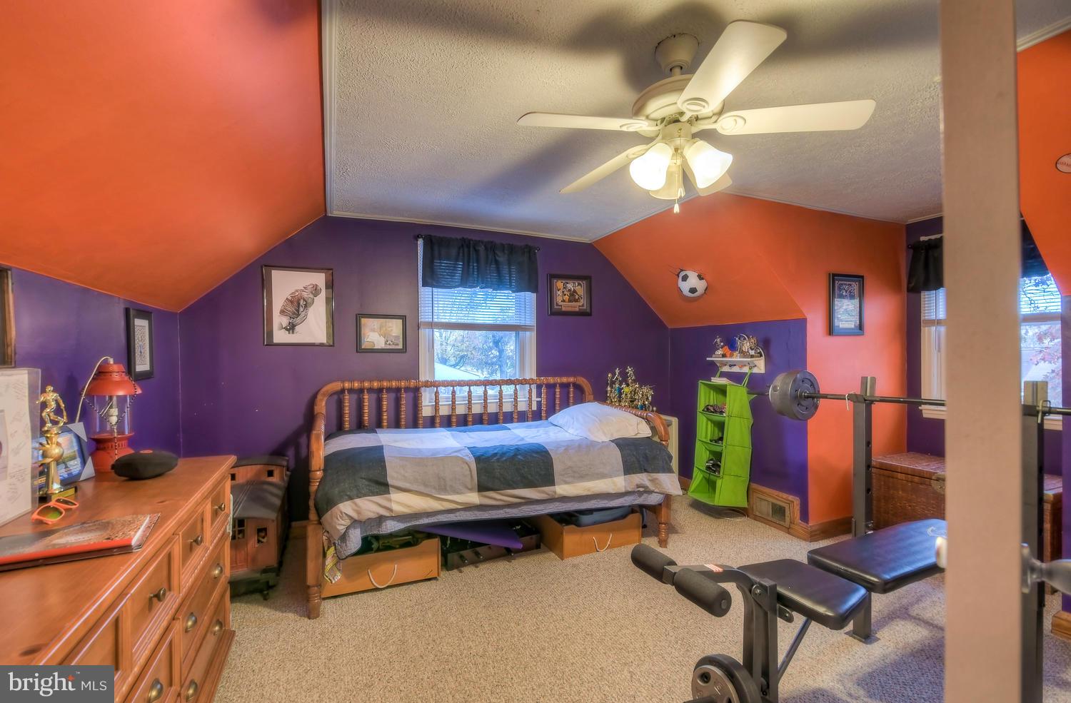322 Upperlanding Road Baltimore, MD 21221 - Photo 25 of 37 a bedroom with a bed and a chandelier