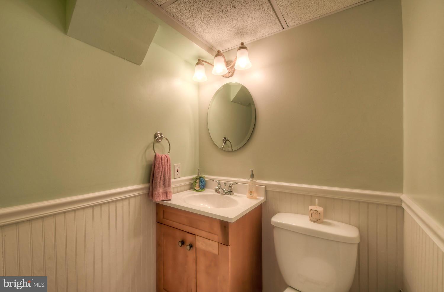 322 Upperlanding Road Baltimore, MD 21221 - Photo 33 of 37 a bathroom with a sink and a mirror