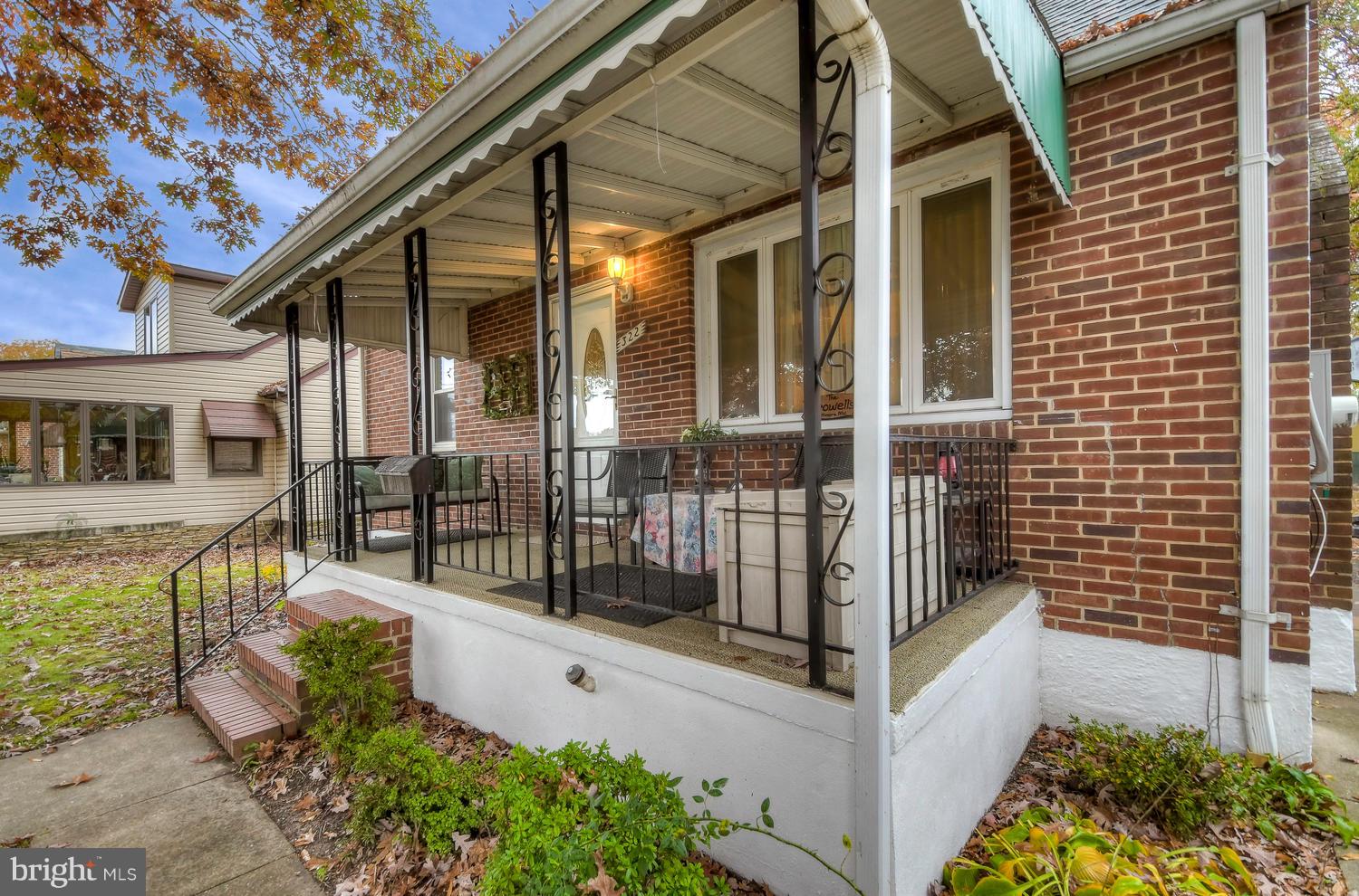 322 Upperlanding Road Baltimore, MD 21221 - Photo 4 of 37 a view of a house with wooden fence and a porch