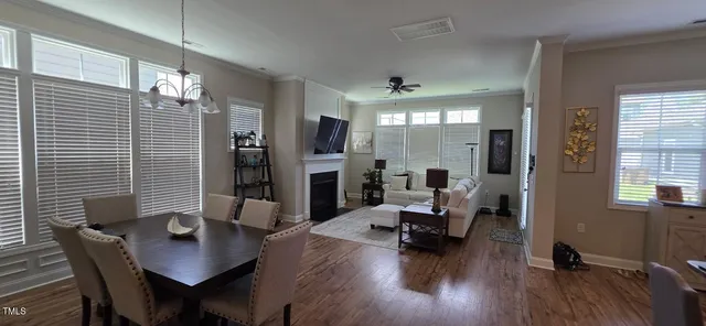 a living room with furniture window and wooden floor