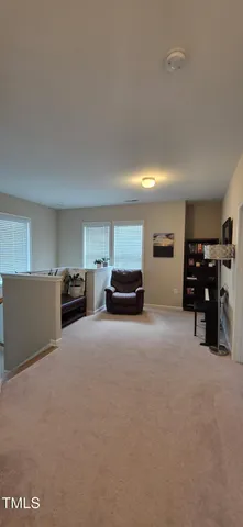 a living room with furniture and cars