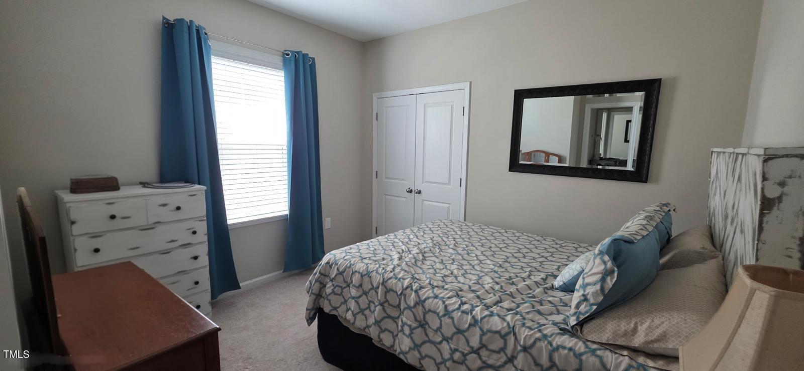 1656 Silo Ridge Drive Wake Forest, NC 27587 - Photo 10 of 17 a bedroom with a bed and a dresser