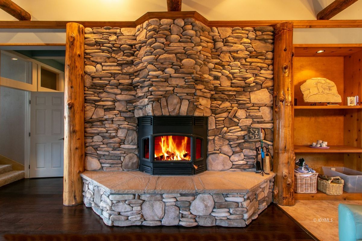 54850 Chipmunk Drive Idyllwild, CA 92549 - Photo 17 of 44 a room with a fireplace and flat screen tv