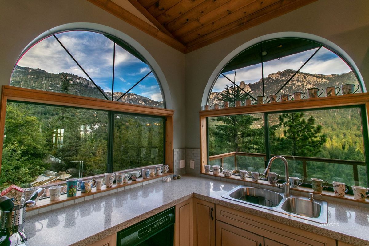 54850 Chipmunk Drive Idyllwild, CA 92549 - Photo 22 of 44 a kitchen with a large window and a sink