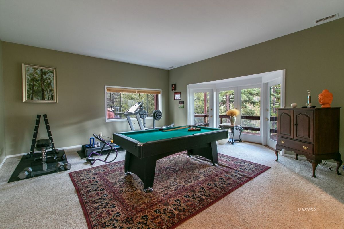 54850 Chipmunk Drive Idyllwild, CA 92549 - Photo 31 of 44 a living room with furniture and a fireplace