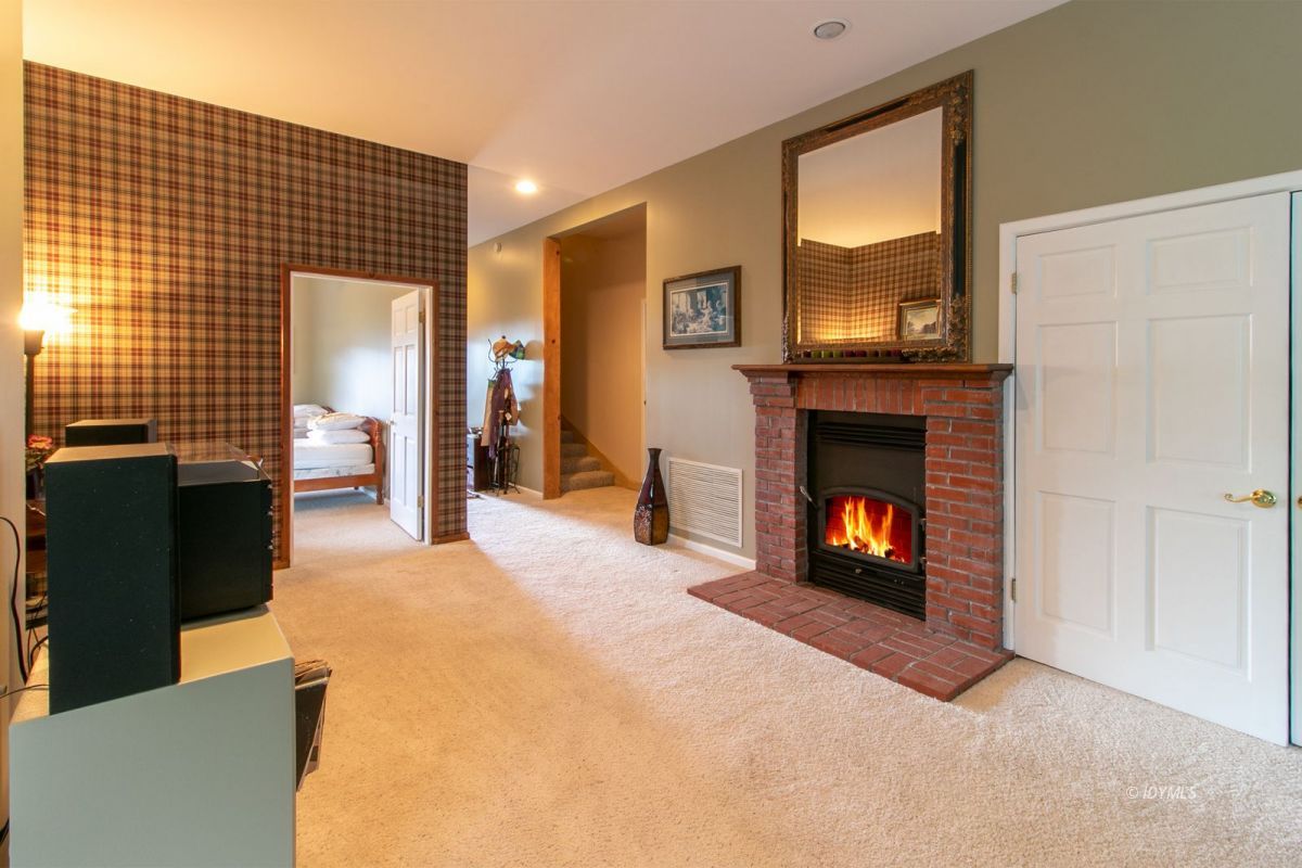 54850 Chipmunk Drive Idyllwild, CA 92549 - Photo 32 of 44 a view of a livingroom with a fireplace and window