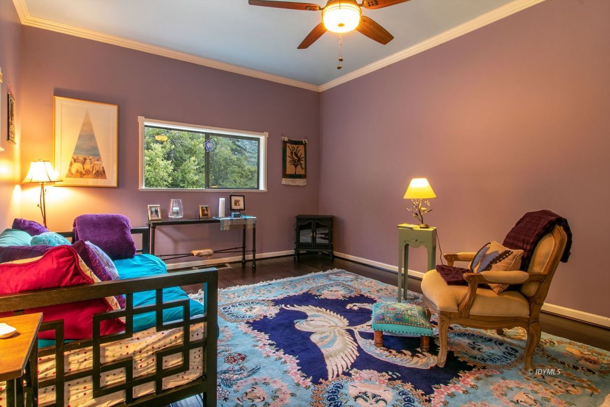 54850 Chipmunk Drive Idyllwild, CA 92549 - Photo 40 of 44 a living room with furniture a window and a flat screen tv