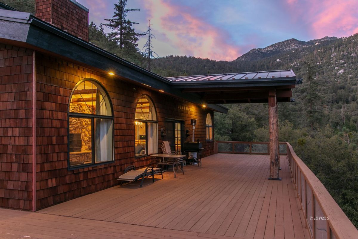 54850 Chipmunk Drive Idyllwild, CA 92549 - Photo 5 of 44 a view of a porch with furniture and a backyard