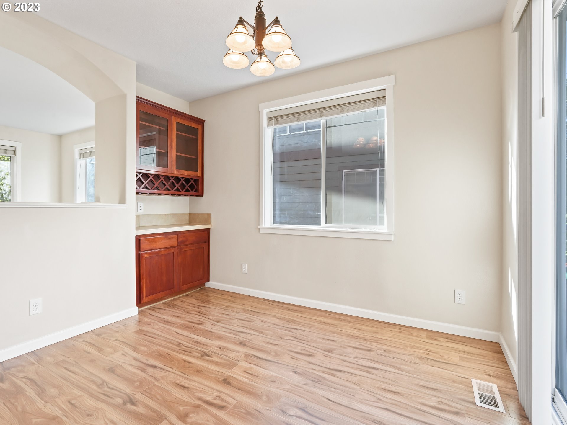 1253 Southwest 162nd Avenue Beaverton, OR 97006 - Photo 20 of 48 a view of a room with wooden floor and a ceiling fan