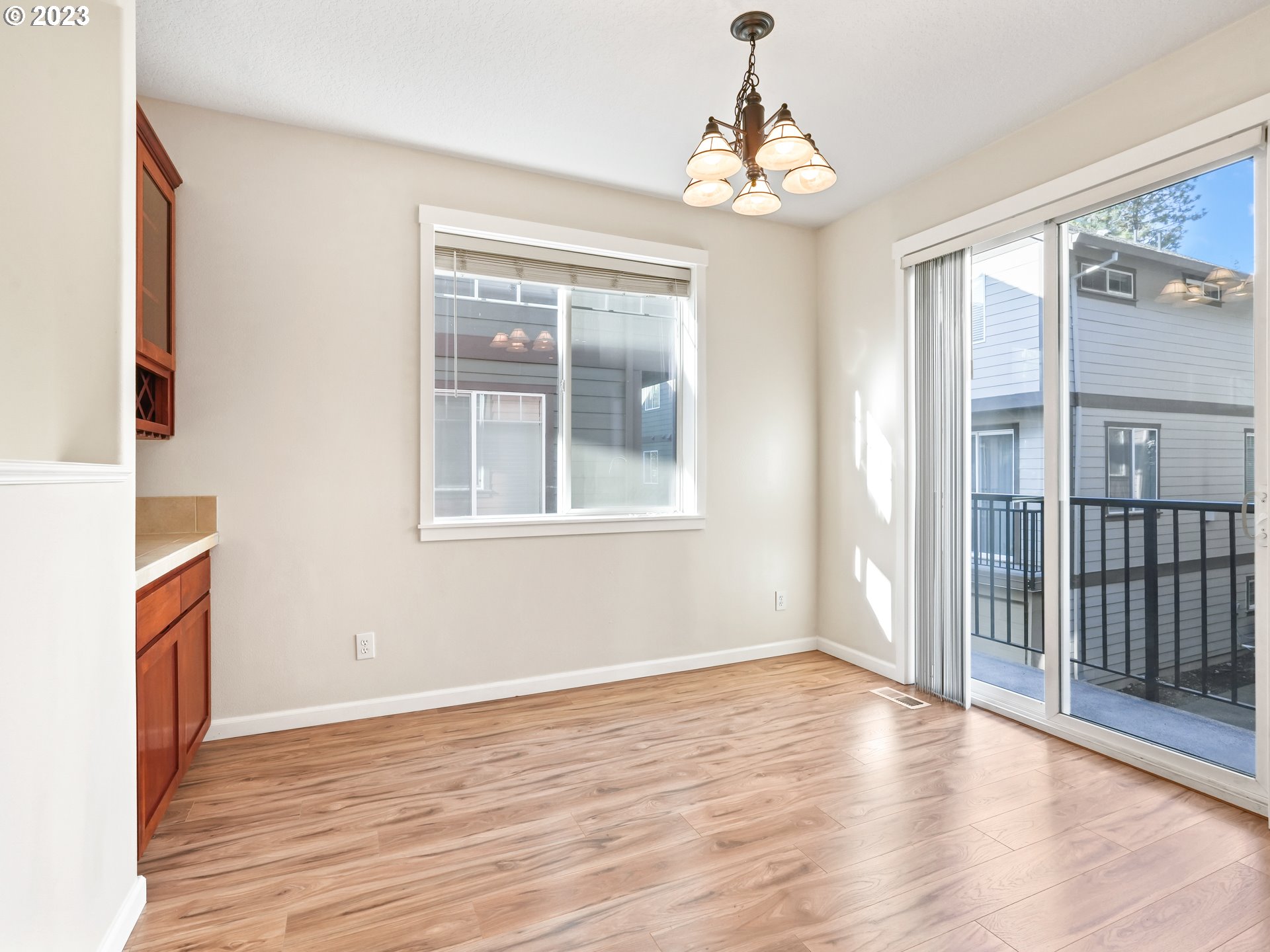 1253 Southwest 162nd Avenue Beaverton, OR 97006 - Photo 21 of 48 a view of an empty room with wooden floor and a window